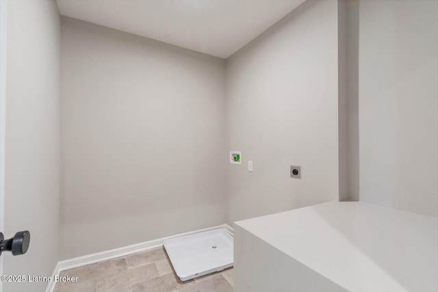 laundry room with electric dryer hookup, washer hookup, and baseboards