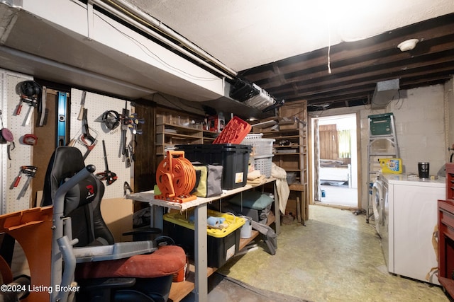 basement featuring independent washer and dryer and a workshop area