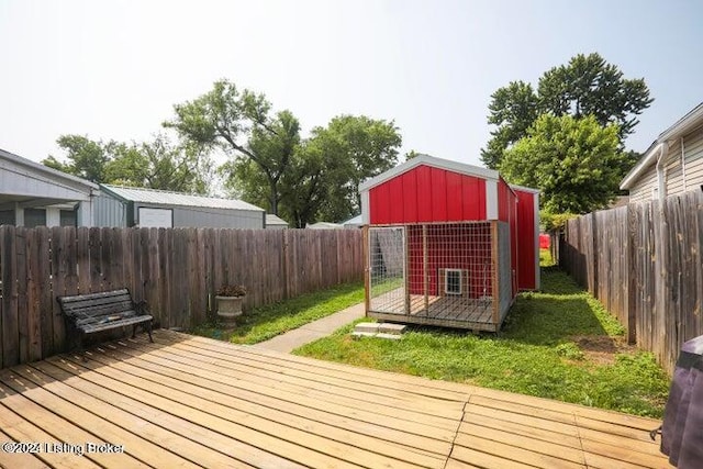 wooden deck featuring a shed