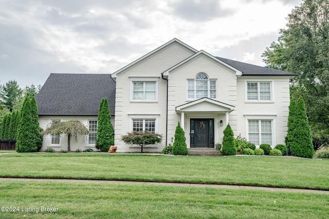 view of front of home with a front lawn