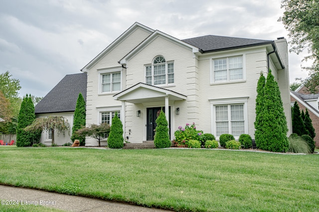 view of front of house with a front lawn