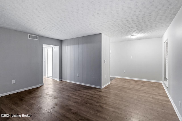 1710 Liberty Bell Way, Louisville, KY 40215 - unfurnished room with wood-type flooring and a textured ceiling