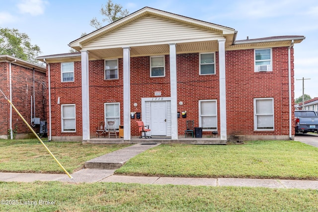 1710 Liberty Bell Way, Louisville, KY 40215 - view of front of home featuring a front yard, brick siding, and covered porch