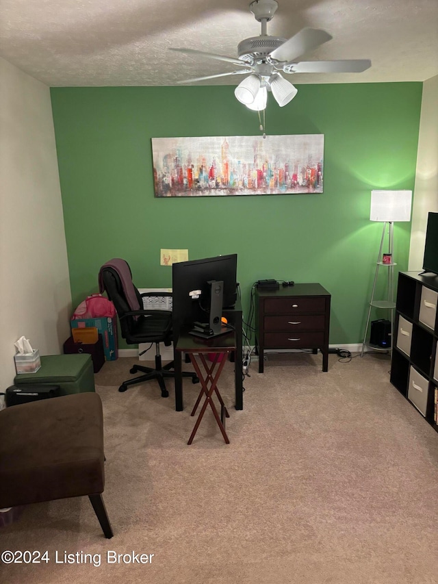 home office with ceiling fan, light colored carpet, and a textured ceiling