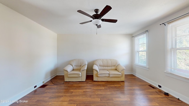 unfurnished room with dark hardwood / wood-style floors and ceiling fan