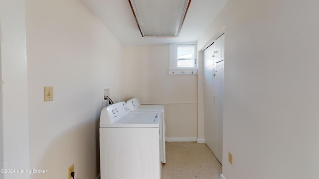 laundry room featuring separate washer and dryer