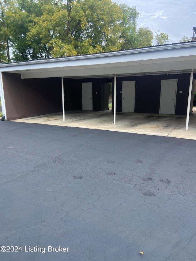 view of parking / parking lot with a carport