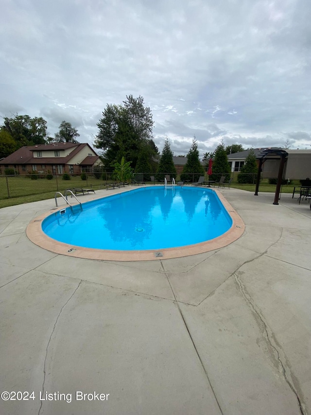 view of pool featuring a pergola and a patio