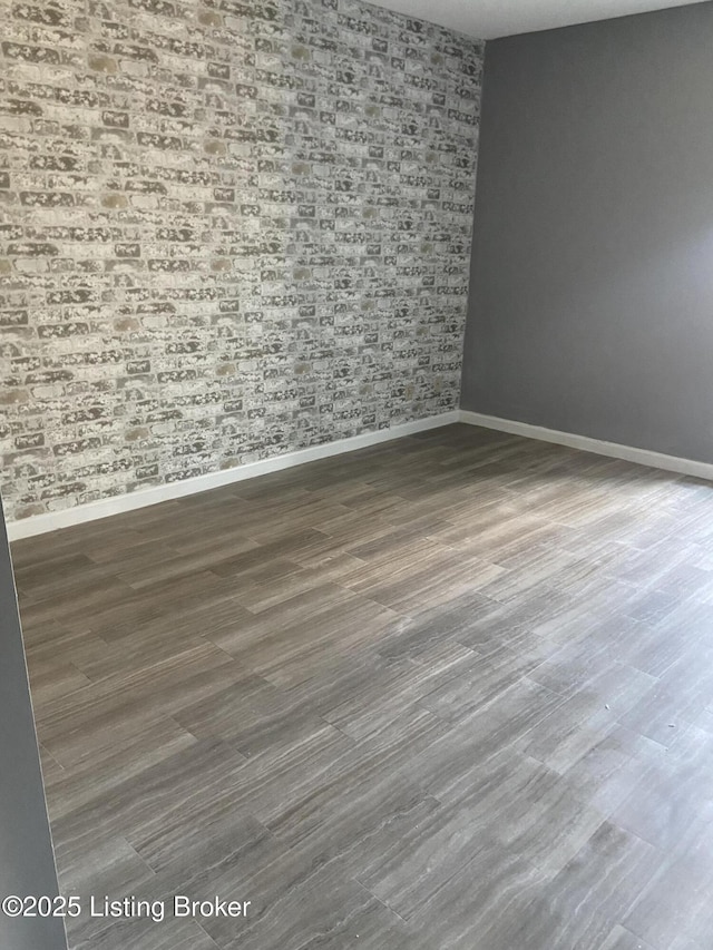 empty room featuring dark hardwood / wood-style flooring