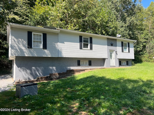 split foyer home featuring a front yard and central air condition unit