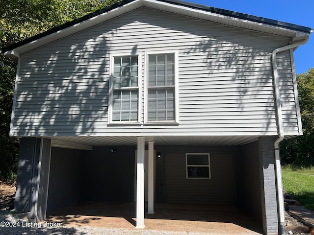 view of home's exterior featuring a carport