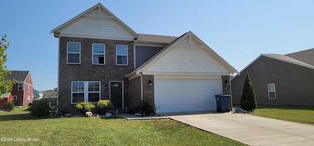 view of front facade with a front yard and a garage