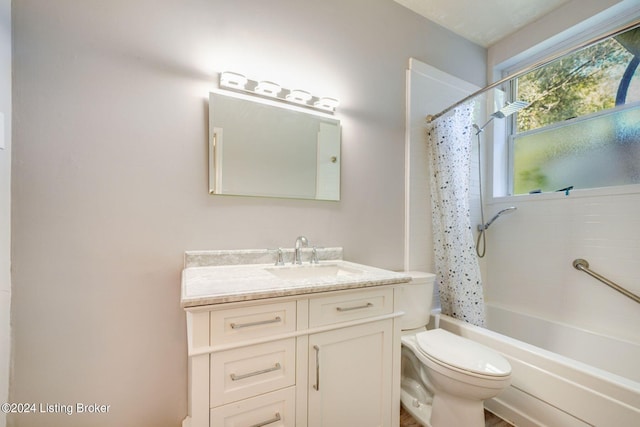 full bathroom with vanity, toilet, and shower / bath combo with shower curtain