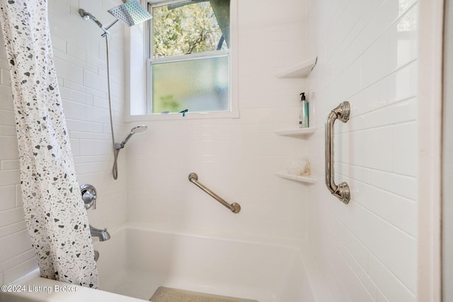 bathroom with shower / bathtub combination with curtain