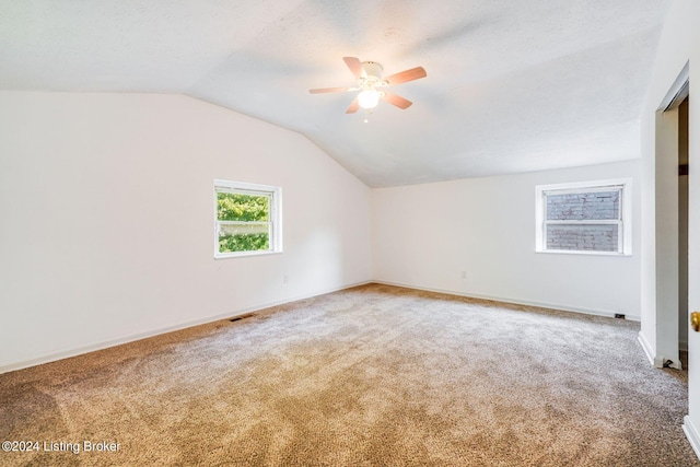 bonus room with carpet, vaulted ceiling, and ceiling fan