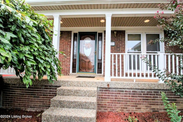 doorway to property featuring covered porch