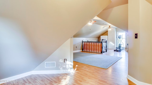 interior space featuring vaulted ceiling and light hardwood / wood-style floors