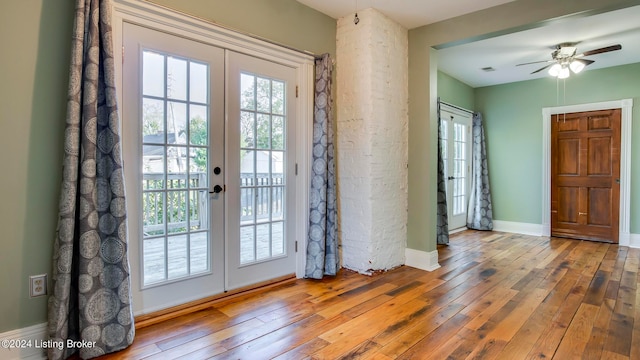 interior space with french doors, hardwood / wood-style floors, and ceiling fan