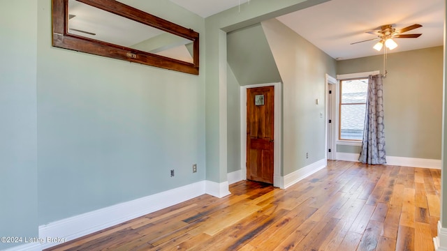 spare room featuring light wood-type flooring and ceiling fan