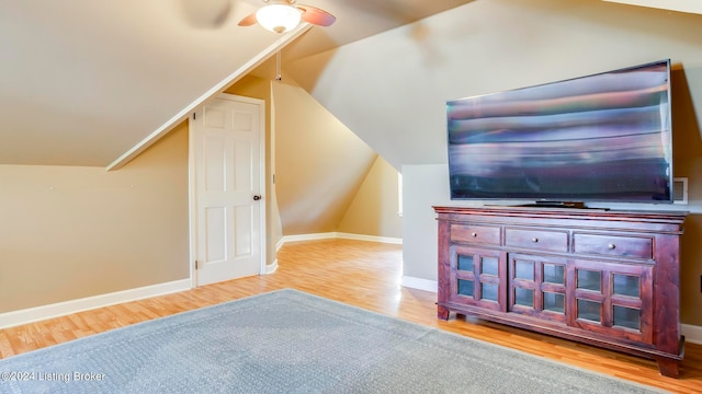 interior space featuring lofted ceiling, ceiling fan, and light hardwood / wood-style flooring