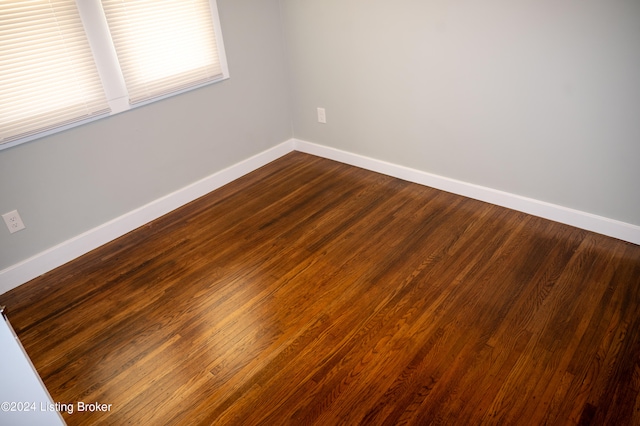 unfurnished room featuring wood-type flooring