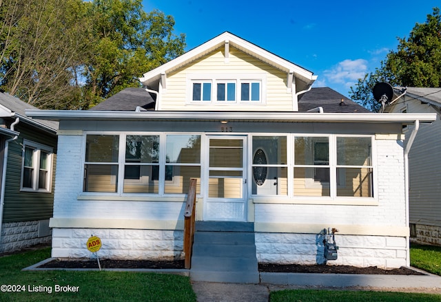 view of front facade featuring a sunroom