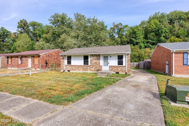 ranch-style home with a front lawn