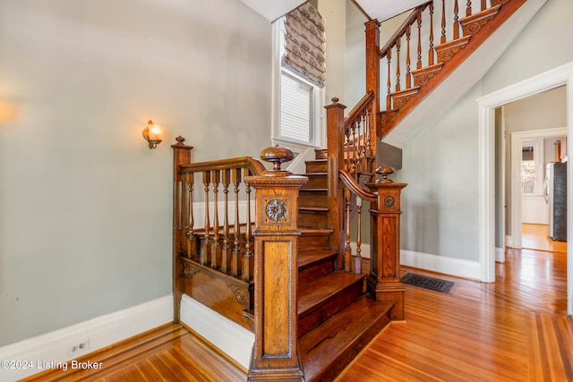 staircase featuring hardwood / wood-style floors