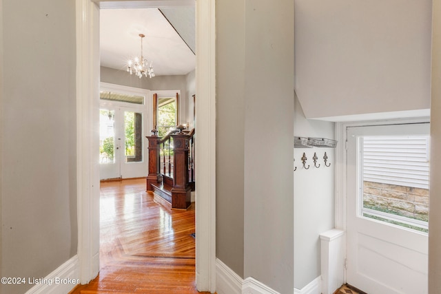 hallway with a chandelier