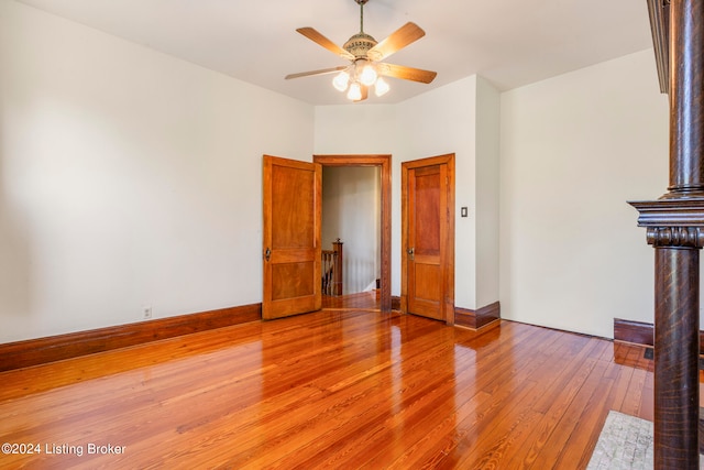 unfurnished living room with light hardwood / wood-style flooring and ceiling fan