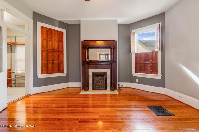 unfurnished living room with light hardwood / wood-style flooring