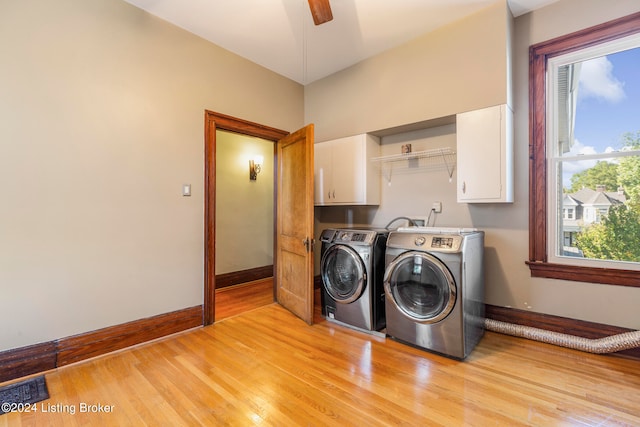 laundry room featuring ceiling fan, cabinets, light wood-type flooring, and independent washer and dryer