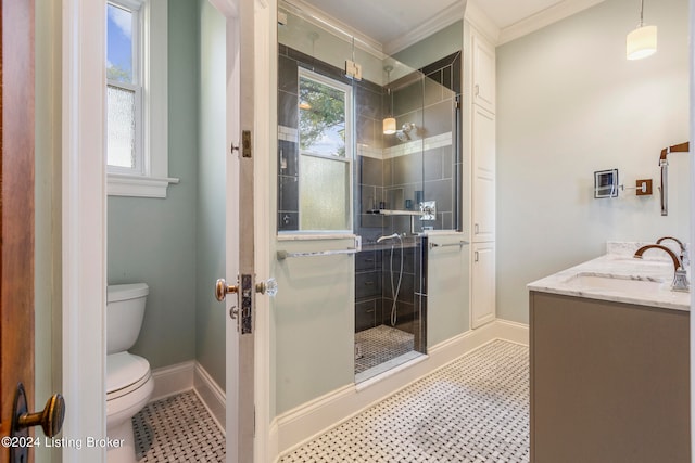 bathroom with a tile shower, crown molding, toilet, and vanity