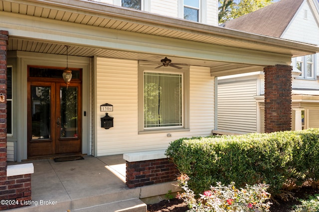 entrance to property featuring covered porch and ceiling fan