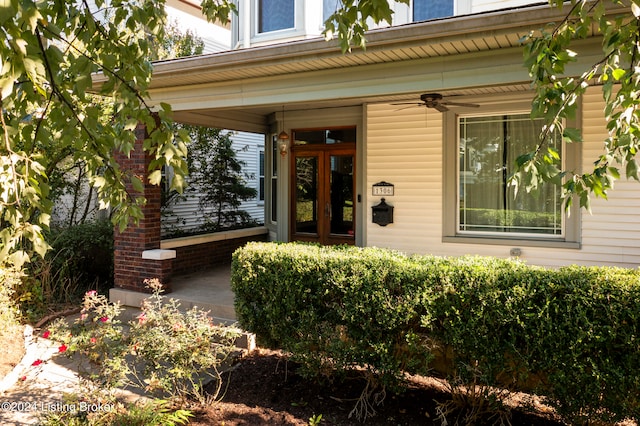 entrance to property featuring ceiling fan and french doors