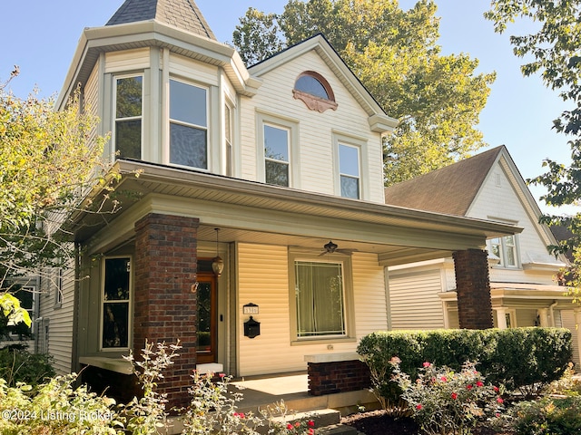 victorian house featuring covered porch