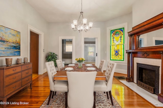 dining room featuring a notable chandelier and light hardwood / wood-style flooring