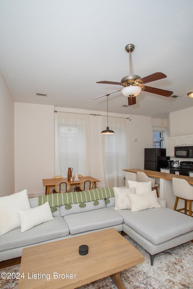 living room with ceiling fan