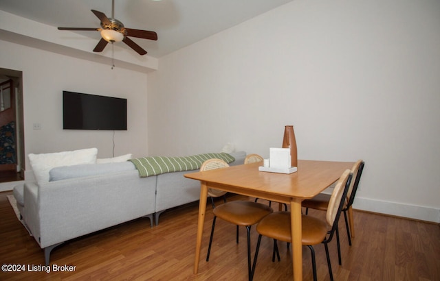 dining room featuring wood-type flooring and ceiling fan