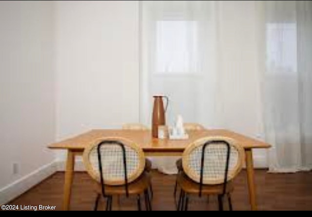 dining area featuring dark hardwood / wood-style flooring