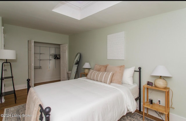 bedroom featuring wood-type flooring and a closet