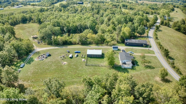 birds eye view of property with a rural view