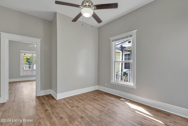 unfurnished room featuring light wood-type flooring and ceiling fan