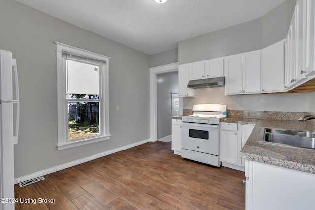 kitchen with white appliances, white cabinetry, dark hardwood / wood-style flooring, and sink