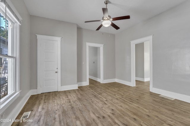 unfurnished bedroom with light wood-type flooring and ceiling fan