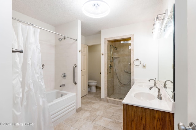 full bathroom with vanity, toilet, a textured ceiling, shower / bathtub combination with curtain, and tile patterned flooring