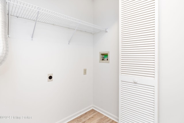 washroom with hardwood / wood-style floors, hookup for an electric dryer, and washer hookup