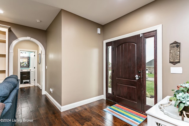 foyer entrance with dark hardwood / wood-style flooring