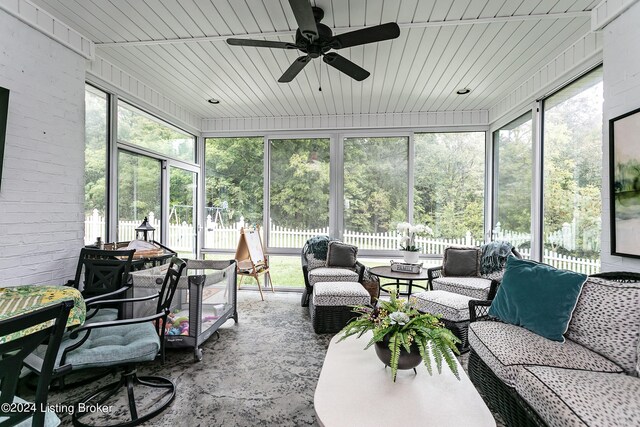 sunroom / solarium featuring wooden ceiling and ceiling fan