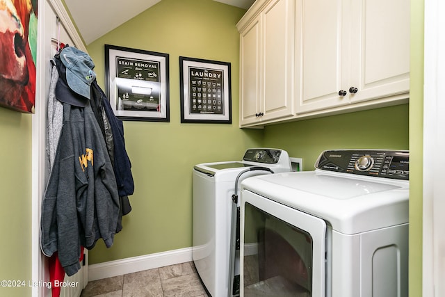 laundry room with cabinets, independent washer and dryer, and light tile patterned flooring